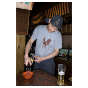 man pouring sake