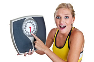 frustrated woman with scale