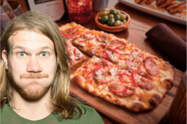 Funny reaction to pizza, illustrating NYC nutritionist tips on portion control and mindful eating with humor