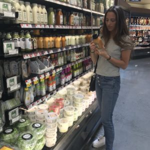 girl reading food labels