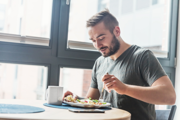 Eating a fiber-rich breakfast with whole foods to support digestion and regular bowel movements